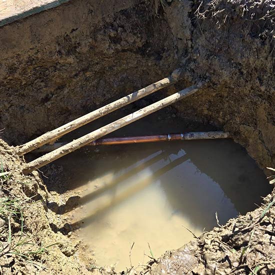 Repaired plumbing pipes under ground