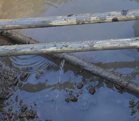 Broken plumbing pipe actively leaking water