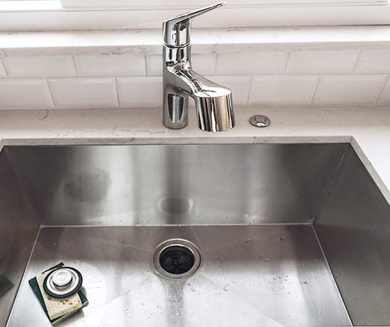 Kitchen sink with an installed garbage disposal