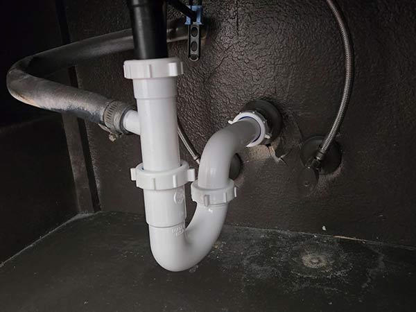 PVC pipes for plumbing under a sink