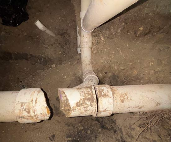 Broken sewer line pipe underneath the foundation of a Dallas, TX home