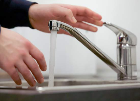sink running hot water