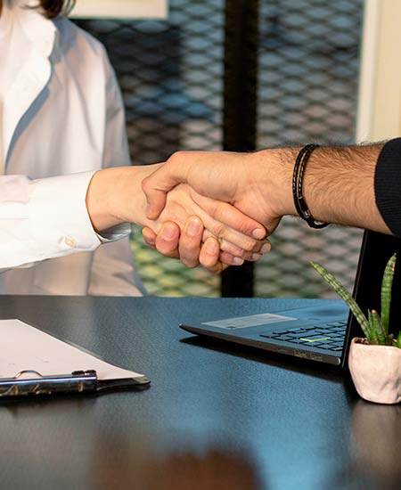 Two people shaking hands.