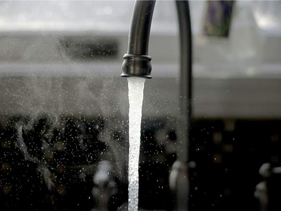 Running water from a faucet